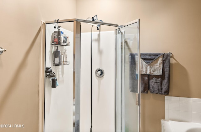 bathroom with independent shower and bath