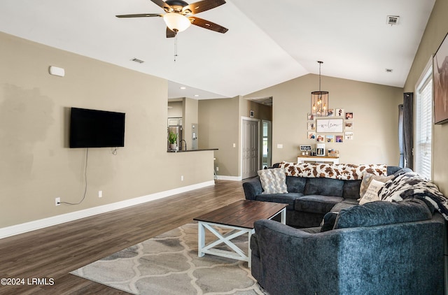 living room featuring hardwood / wood-style flooring, ceiling fan, sink, and vaulted ceiling