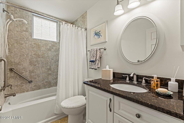 full bathroom featuring shower / tub combo, vanity, and toilet