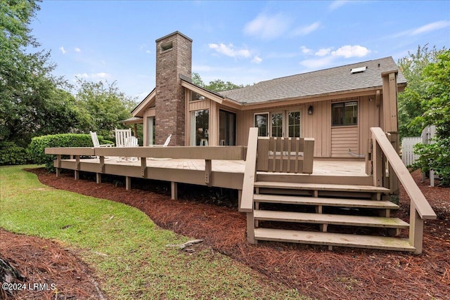 back of house featuring a wooden deck