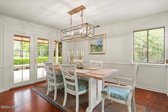 dining area featuring dark wood-type flooring