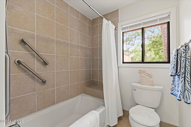 bathroom with tile patterned floors, shower / bath combination with curtain, and toilet