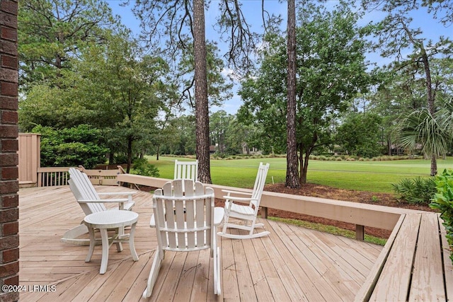 wooden deck with a yard