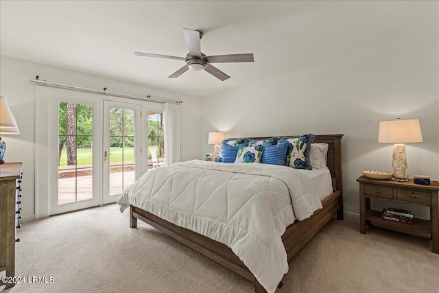 bedroom featuring access to exterior, light colored carpet, and ceiling fan