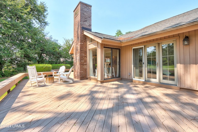 wooden deck with a fire pit