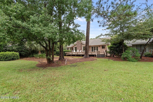 view of yard with a deck