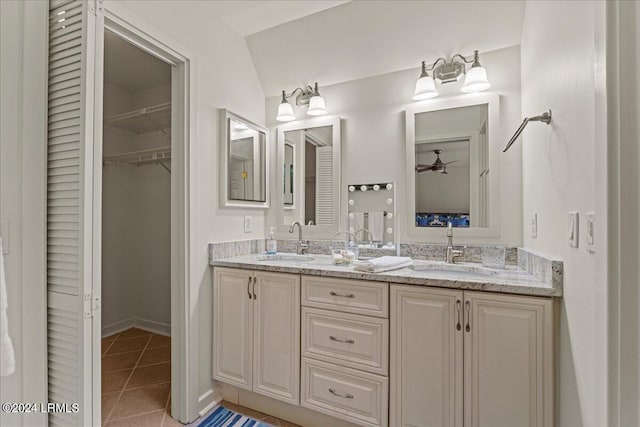 bathroom featuring vaulted ceiling, ceiling fan, vanity, and tile patterned flooring