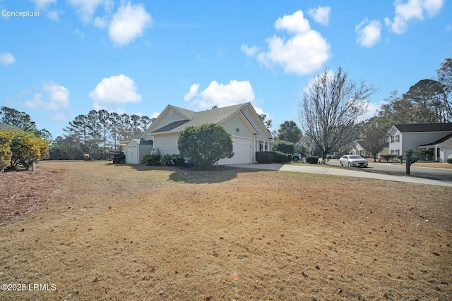 view of home's exterior with a garage and a lawn