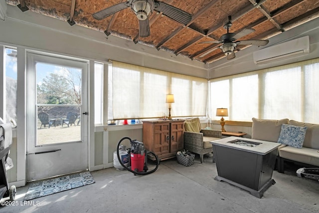 sunroom / solarium featuring ceiling fan and an AC wall unit