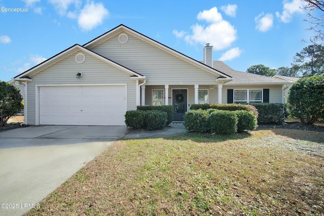 view of front of house featuring a garage and a front lawn