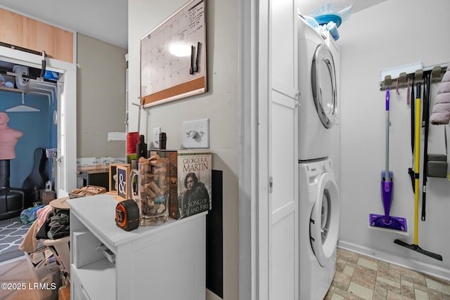 laundry room featuring stacked washer / dryer