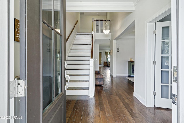 296 Hulston Landing Rd, Bluffton, SC 29909 - entrance foyer with crown molding, dark wood-style flooring, and stairway