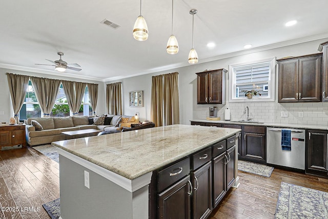 296 Hulston Landing Rd, Bluffton, SC 29909 - kitchen with stainless steel dishwasher, crown molding, dark wood-style flooring, ceiling fan, and decorative backsplash