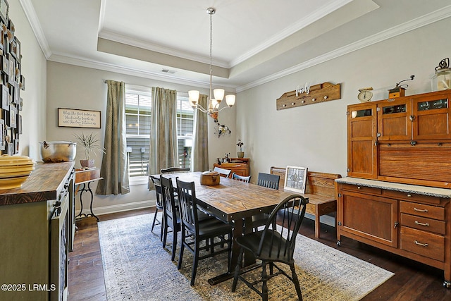 296 Hulston Landing Rd, Bluffton, SC 29909 - dining room featuring a raised ceiling, dark wood-style flooring, a chandelier, and crown molding