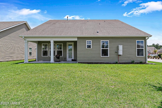 296 Hulston Landing Rd, Bluffton, SC 29909 - back of property with a lawn, a patio area, and a shingled roof