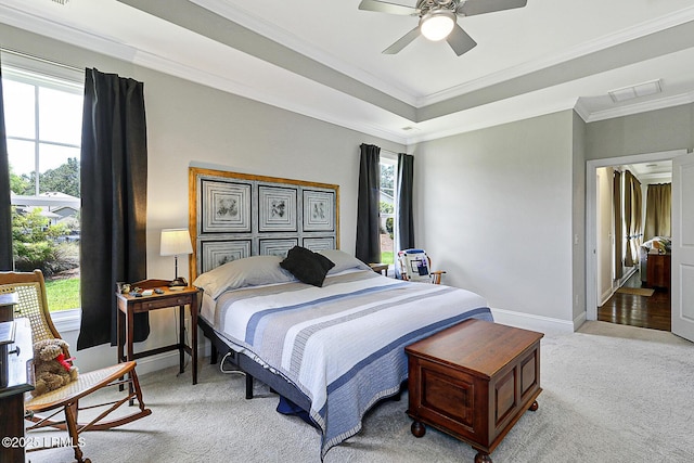 296 Hulston Landing Rd, Bluffton, SC 29909 - bedroom with light colored carpet, crown molding, ceiling fan, and a tray ceiling