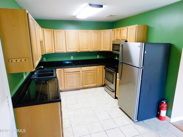 4348 Pinewood Cir, Beaufort, SC 29906 - kitchen with sink, appliances with stainless steel finishes, and light brown cabinetry