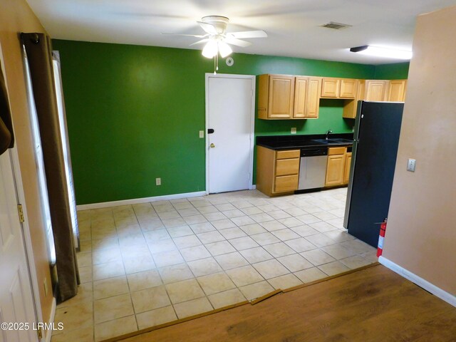4348 Pinewood Cir, Beaufort, SC 29906 - kitchen with light brown cabinetry, black refrigerator, dishwasher, ceiling fan, and sink