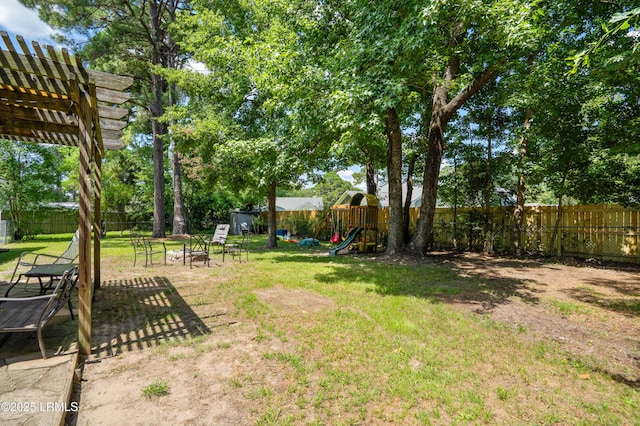 6 Wegeon Ln, Beaufort, SC 29906 - fenced backyard with a playground, a pergola, and a fire pit