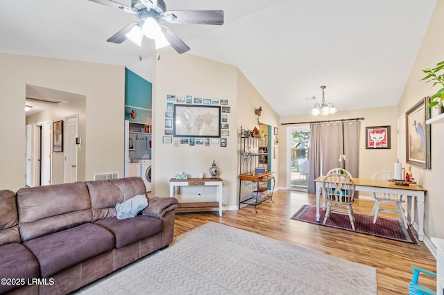 6 Wegeon Ln, Beaufort, SC 29906 - living room with vaulted ceiling, a chandelier, wood finished floors, washer / clothes dryer, and ceiling fan