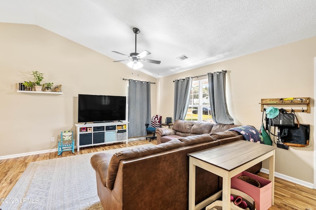 6 Wegeon Ln, Beaufort, SC 29906 - living room with lofted ceiling, ceiling fan, wood finished floors, and a textured ceiling