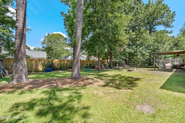 6 Wegeon Ln, Beaufort, SC 29906 - fenced backyard with a playground and an outdoor fire pit