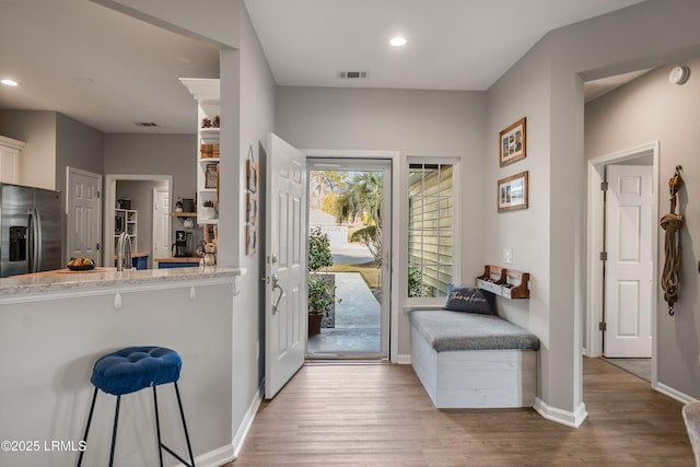 interior space with hardwood / wood-style flooring and sink