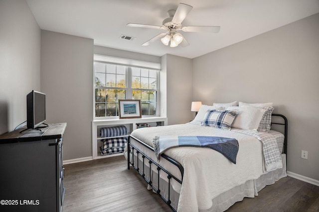 bedroom featuring dark hardwood / wood-style flooring and ceiling fan