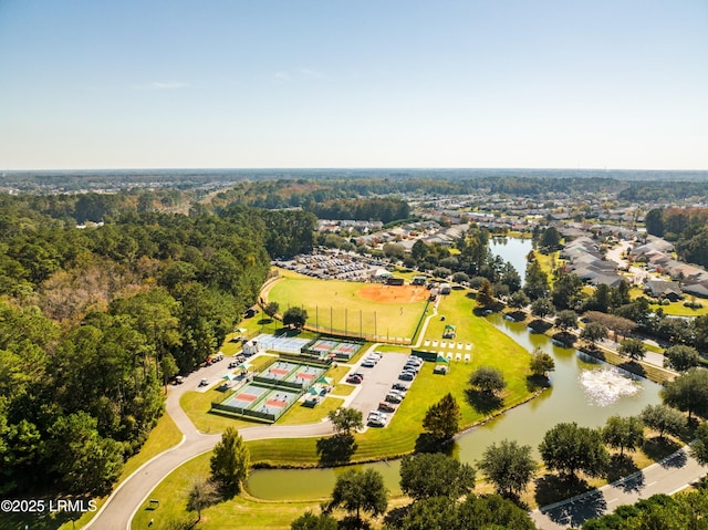 birds eye view of property with a water view