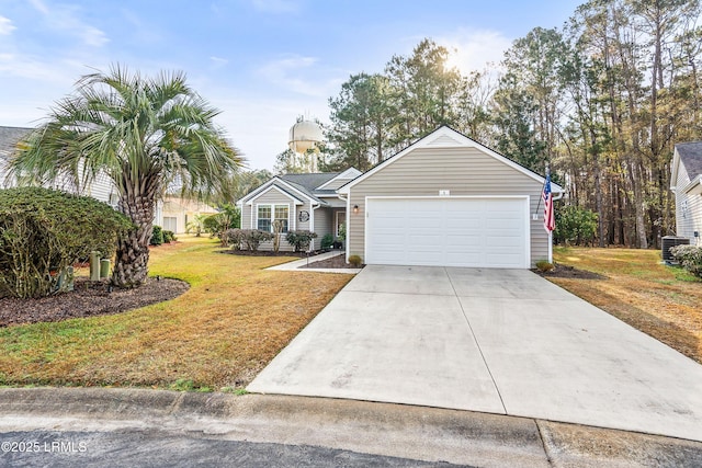 ranch-style home with a garage and a front lawn