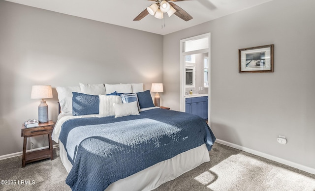 carpeted bedroom with connected bathroom and ceiling fan