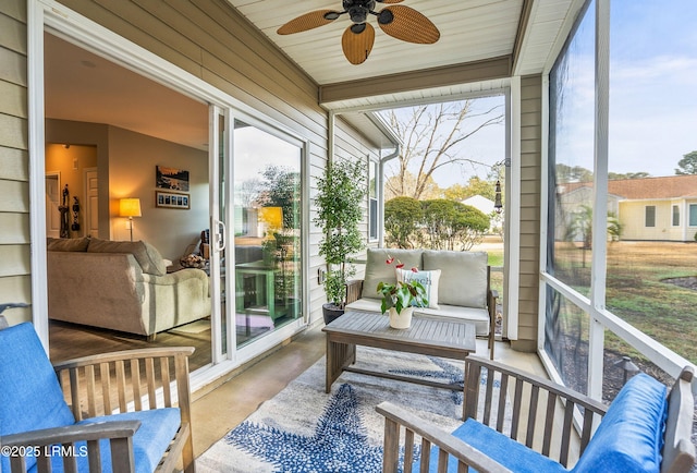 sunroom featuring ceiling fan