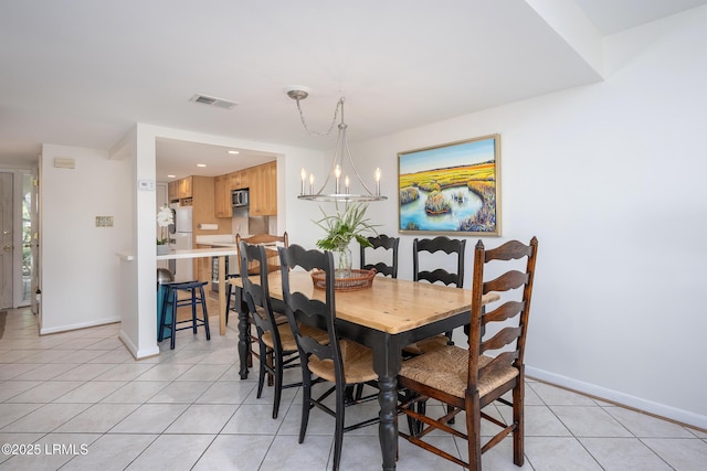 4 Marsh Harbor Dr Unit D, Beaufort, SC 29907 - dining room featuring light tile patterned flooring, baseboards, and a chandelier