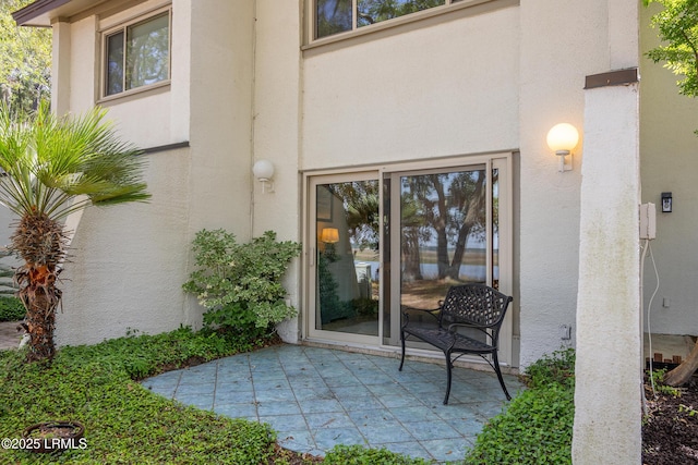 4 Marsh Harbor Dr Unit D, Beaufort, SC 29907 - doorway to property featuring stucco siding and a patio area