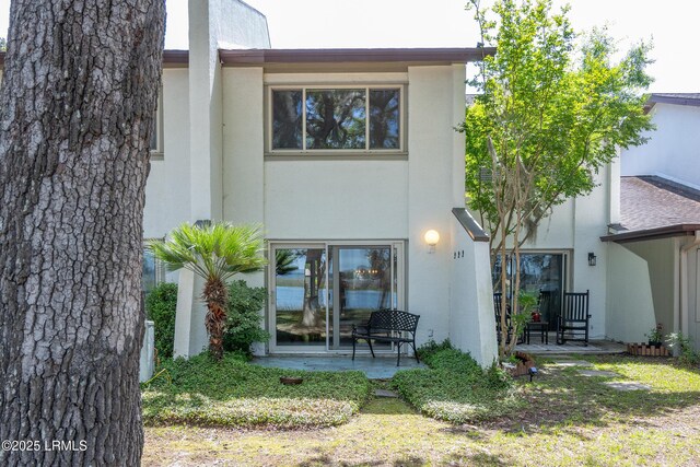 4 Marsh Harbor Dr Unit D, Beaufort, SC 29907 - rear view of house with stucco siding and a patio area