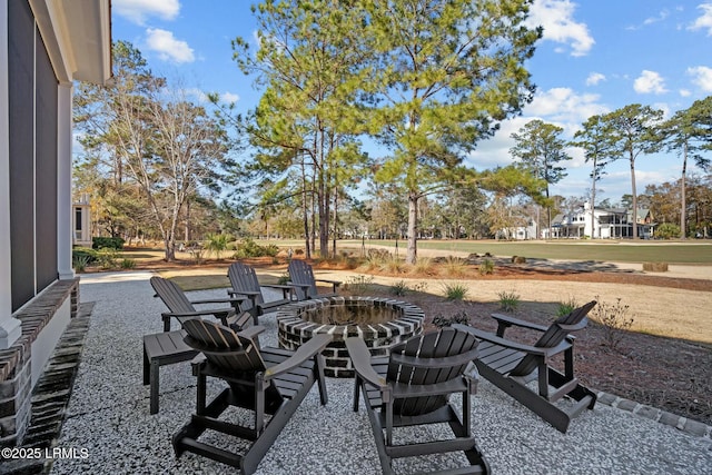 view of patio / terrace featuring an outdoor fire pit