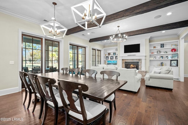 dining space with beamed ceiling, a fireplace, an inviting chandelier, and built in shelves