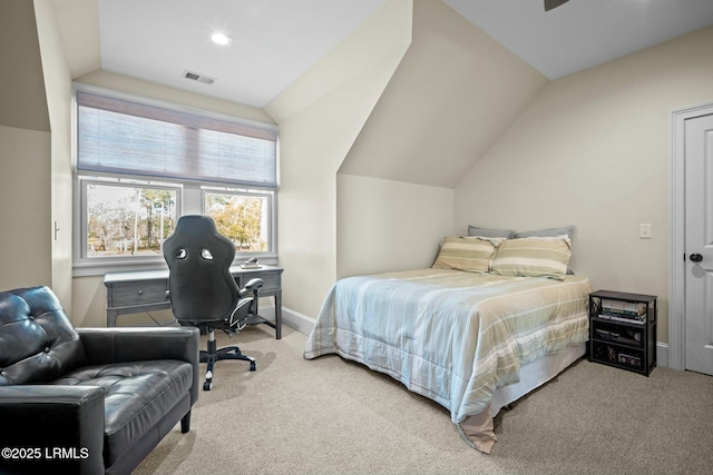 carpeted bedroom with vaulted ceiling