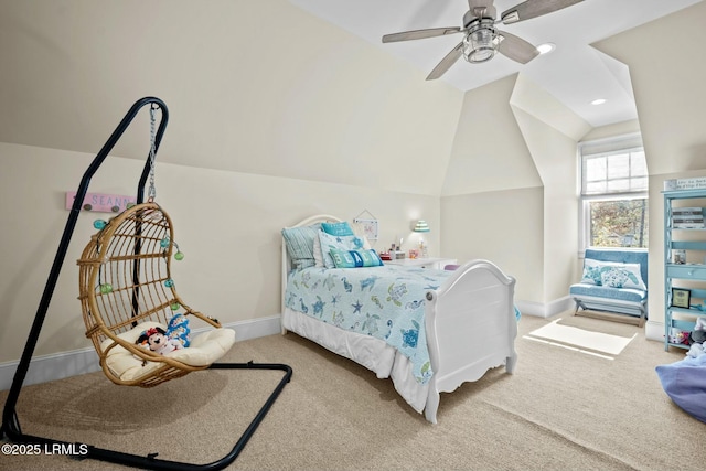 carpeted bedroom with ceiling fan and vaulted ceiling