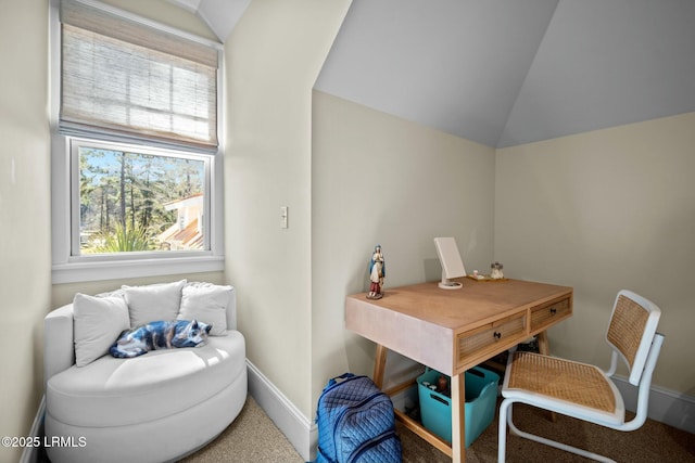 carpeted office space with lofted ceiling