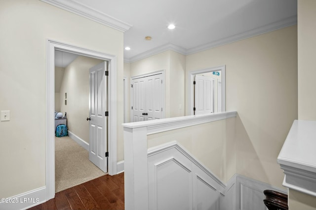 hall featuring dark wood-type flooring and crown molding