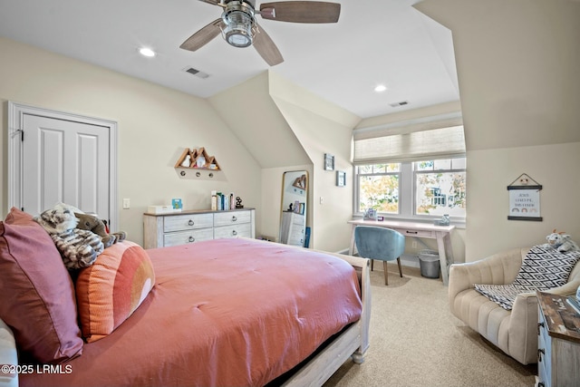 bedroom with ceiling fan, vaulted ceiling, and light carpet