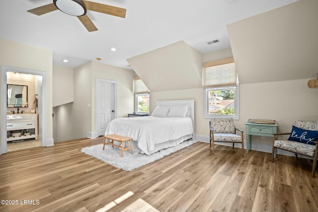 bedroom with lofted ceiling, light hardwood / wood-style floors, and ceiling fan