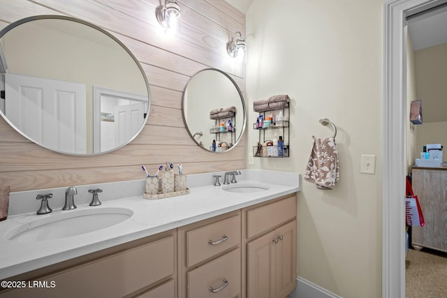 bathroom featuring vanity and wood walls