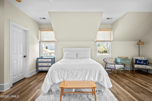 bedroom featuring hardwood / wood-style flooring and vaulted ceiling