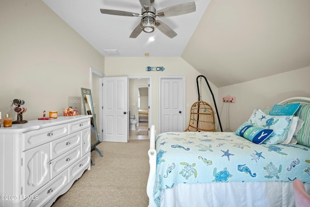 carpeted bedroom with ceiling fan and lofted ceiling