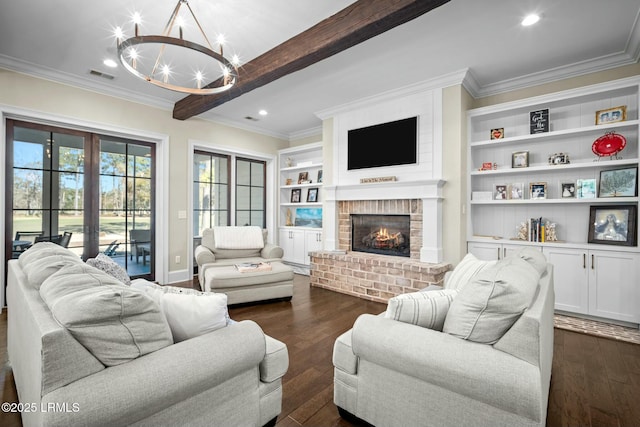 living room featuring a fireplace, beamed ceiling, a chandelier, crown molding, and dark wood-type flooring