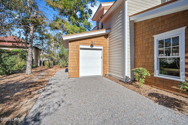 view of side of home with a garage