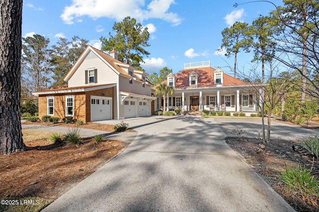 view of front of property with a garage and a porch