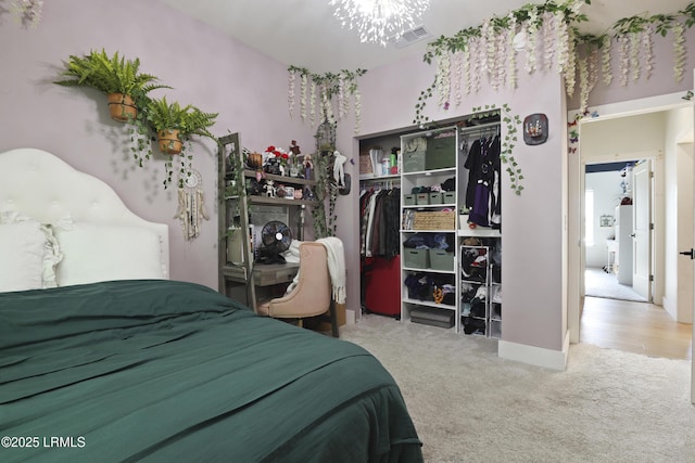 5 Canebrake Ln, Bluffton, SC 29910 - carpeted bedroom with a closet and a chandelier